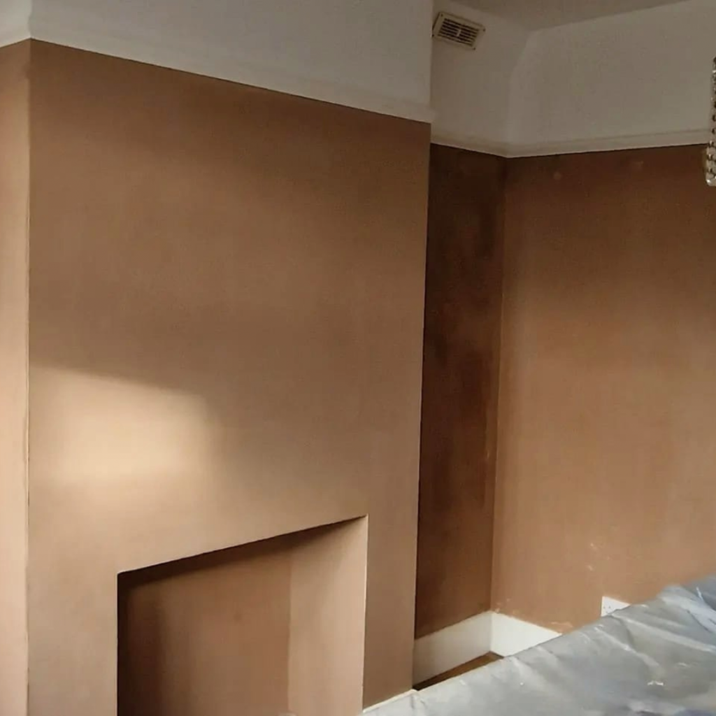 Freshly skimmed room including fireplace and alcoves 