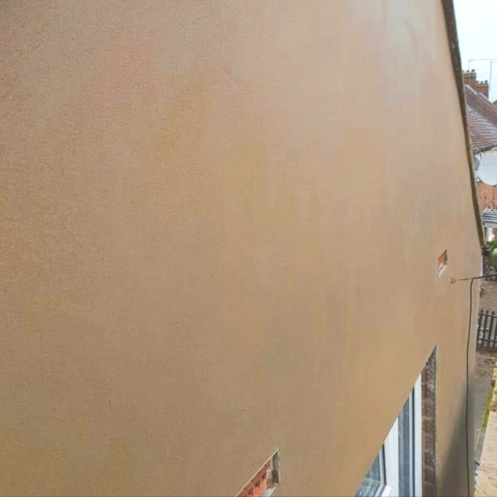 Gable end with sand and cement render